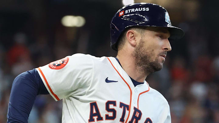 Oct 1, 2024; Houston, Texas, USA; Houston Astros third base Alex Bregman (2) hits a single against the Detroit Tigers in game one of the Wild Card round for the 2024 MLB Playoffs at Minute Maid Park