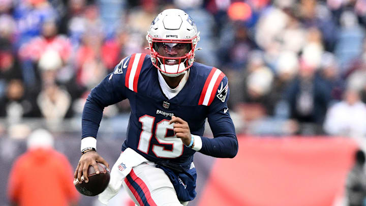 Jan 5, 2025; Foxborough, Massachusetts, USA; New England Patriots quarterback Joe Milton III (19) runs against the Buffalo Bills during the first half at Gillette Stadium.