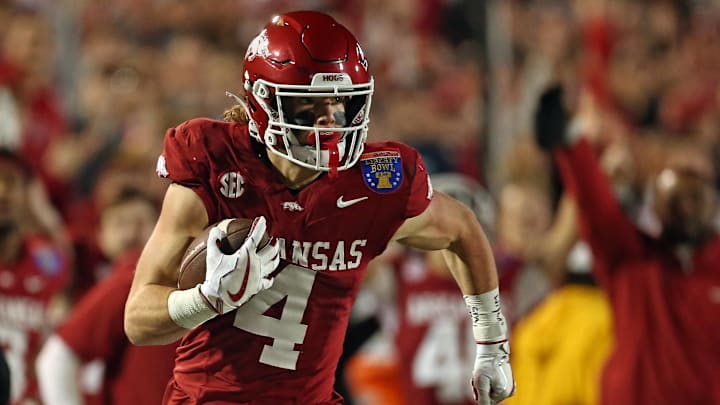 Arkansas Razorbacks wide receiver Isaac TeSlaa (4) runs after a catch for a first down during the first quarter against the Texas Tech Red Raiders at Simmons Bank Liberty Stadium. 