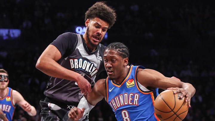 Feb 26, 2025; Brooklyn, New York, USA;  Oklahoma City Thunder forward Jalen Williams (8) looks to drive past Brooklyn Nets forward Cameron Johnson (2) in the first quarter at Barclays Center. Mandatory Credit: Wendell Cruz-Imagn Images