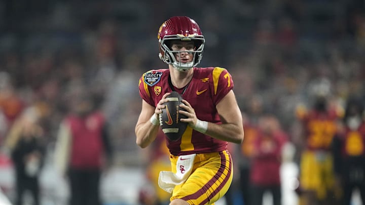 Dec 27, 2023; San Diego, CA, USA; Southern California Trojans quarterback Miller Moss (7) throws the ball against the Louisville Cardinalsin the first half of the Holiday Bowl at Petco Park. Mandatory Credit: Kirby Lee-Imagn Images