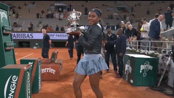 Coco Gauff takes a video with her trophy after winning the French Open. Coco Gauff takes a video with her trophy after winning the French Open.