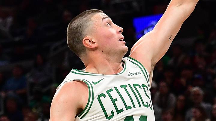 Oct 10, 2026; Boston, Massachusetts, USA;  Philadelphia 76ers guard Tyrese Maxey (0) shoots the ball past Boston Celtics guard Payton Pritchard (11) during the first half at TD Garden. Mandatory Credit: Bob DeChiara-Imagn Images