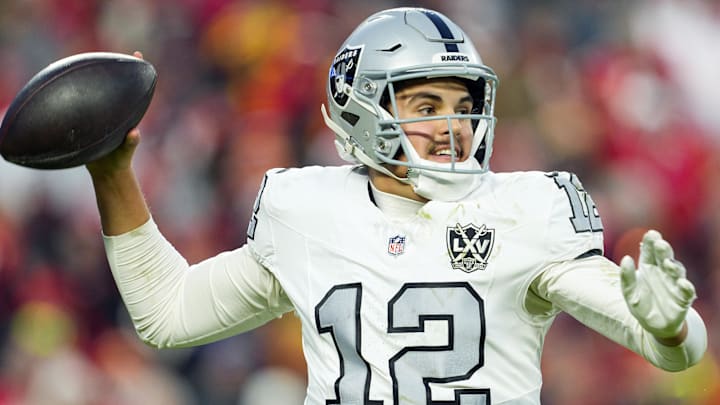 Nov 29, 2024; Kansas City, Missouri, USA; Las Vegas Raiders quarterback Aidan O'Connell (12) throws a pass during the second half against the Kansas City Chiefs at GEHA Field at Arrowhead Stadium. Mandatory Credit: Jay Biggerstaff-Imagn Images