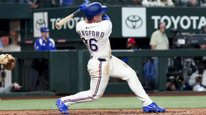 Apr 5, 2025; Arlington, Texas, USA; Texas Rangers left fielder Wyatt Langford (36) hits a two-run home run during the seventh inning against the Tampa Bay Rays at Globe Life Field.