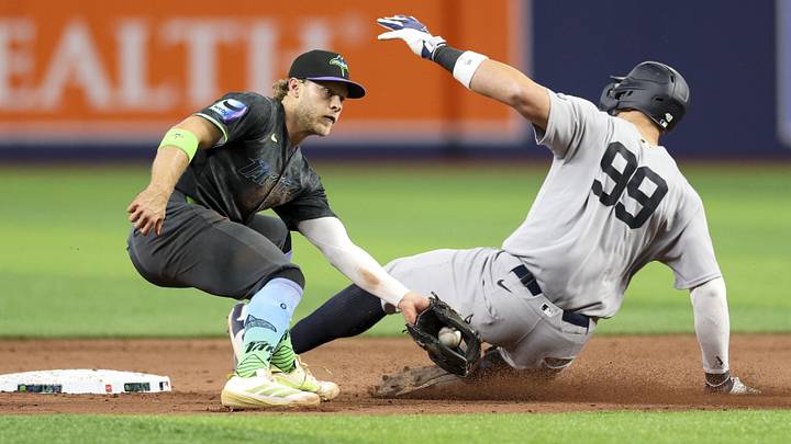 Apr 11, 2026; St. Petersburg, Florida, USA; New York Yankees right fielder Aaron Judge (99) steals second base past Tampa Bay Rays shortstop Taylor Walls (6) in the ninth inning at Tropicana Field. Apr 11, 2026; St. Petersburg, Florida, USA; New York Yankees right fielder Aaron Judge (99) steals second base past Tampa Bay Rays shortstop Taylor Walls (6) in the ninth inning at Tropicana Field.