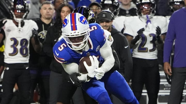 Sep 7, 2025; Orchard Park, New York, USA;  Baltimore Ravens cornerback Nate Wiggins (2) tackles Buffalo Bills wide receiver Joshua Palmer (5) during the second quarter at Highmark Stadium. Mandatory Credit: Gregory Fisher-Imagn Images