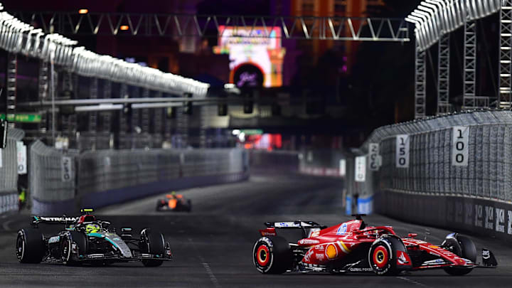 Nov 23, 2024; Las Vegas, Nevada, USA; Scuderia Ferrari driver Charles Leclerc (16) leads Mercedes AMG Petronas driver Lewis Hamilton (44) during the Las Vegas Grand Prix at Las Vegas Circuit. Mandatory Credit: Gary A. Vasquez-Imagn Images