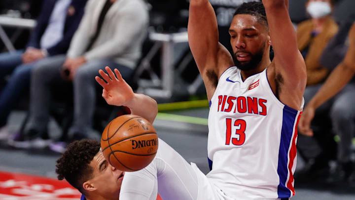 Former Detroit Pistons center Jahlil Okafor (13) dunks on Denver Nuggets forward Michael Porter Jr. (1) in the first half at Little Caesars Arena. Mandatory Credit: Rick Osentoski-Imagn Images