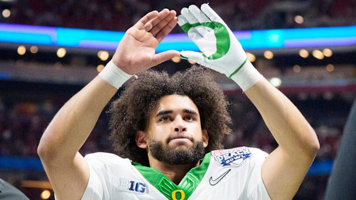 Oregon quarterback Dante Moore walks off the field as the Oregon Ducks face the Indiana Hoosiers in the Peach Bowl on Jan. 9, 2026, at Mercedes-Benz Stadium in Atlanta, Georgia.
