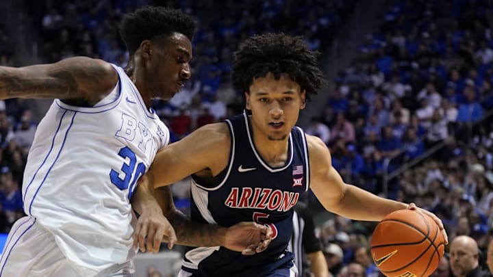 Jan 26, 2026; Provo, Utah, USA; Arizona Wildcats guard Brayden Burries (5) controls the ball while being defended by BYU Cougars forward Kennard Davis Jr. (30) during the second half at Marriott Center. Mandatory Credit: Aaron Baker-Imagn Images Jan 26, 2026; Provo, Utah, USA; Arizona Wildcats guard Brayden Burries (5) controls the ball while being defended by BYU Cougars forward Kennard Davis Jr. (30) during the second half at Marriott Center. Mandatory Credit: Aaron Baker-Imagn Images