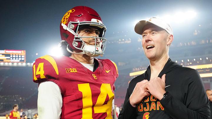 Nov 29, 2025; Los Angeles, California, USA; Southern California Trojans quarterback Jayden Maiava (14) and head coach Lincoln Riley react after the game against the UCLA Bruins at United Airlines Field at Los Angeles Memorial Coliseum. Mandatory Credit: Kirby Lee-Imagn Images Nov 29, 2025; Los Angeles, California, USA; Southern California Trojans quarterback Jayden Maiava (14) and head coach Lincoln Riley react after the game against the UCLA Bruins at United Airlines Field at Los Angeles Memorial Coliseum. Mandatory Credit: Kirby Lee-Imagn Images