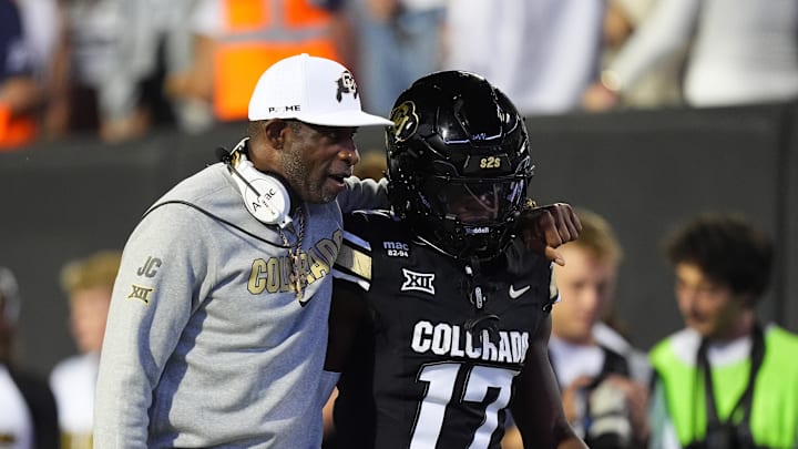 Sep 20, 2025; Boulder, Colorado, USA; Colorado Buffaloes head coach Deion Sanders and wide receiver Isaiah Hardge (17) during the first quarter against the Wyoming Cowboys at Folsom Field. Mandatory Credit: Ron Chenoy-Imagn Images Sep 20, 2025; Boulder, Colorado, USA; Colorado Buffaloes head coach Deion Sanders and wide receiver Isaiah Hardge (17) during the first quarter against the Wyoming Cowboys at Folsom Field. Mandatory Credit: Ron Chenoy-Imagn Images