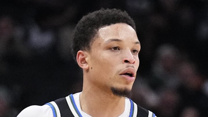 Milwaukee Bucks guard Ryan Rollins brings the ball up the court against the Philadelphia 76ers