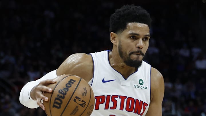 Detroit Pistons forward Tobias Harris dribbles defended by Charlotte Hornets forward Miles Bridges.