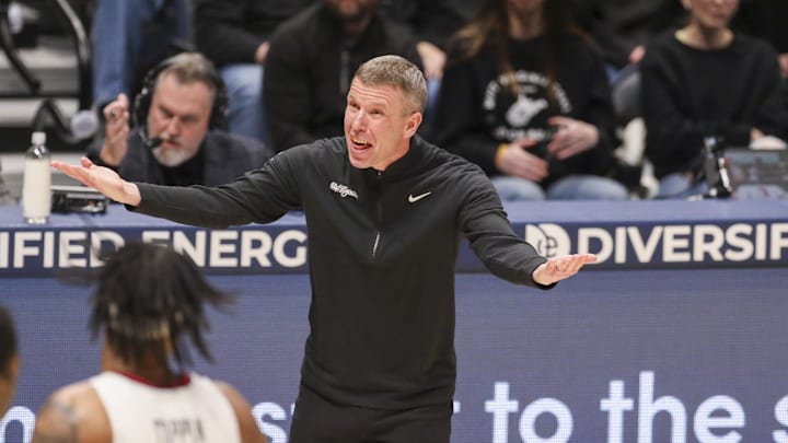 Feb 8, 2026; Morgantown, West Virginia, USA; West Virginia Mountaineers head coach Ross Hodge yells from the sideline during the first half against the Texas Tech Red Raiders at Hope Coliseum. Mandatory Credit: Ben Queen-Imagn Images