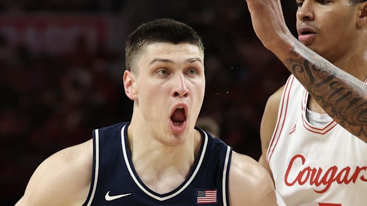 Feb 21, 2026; Houston, Texas, USA; Arizona Wildcats forward Ivan Kharchenkov (8) dribbles against Houston Cougars center Chris Cenac Jr. (5) in the first half at Fertitta Center. Mandatory Credit: Thomas Shea-Imagn Images