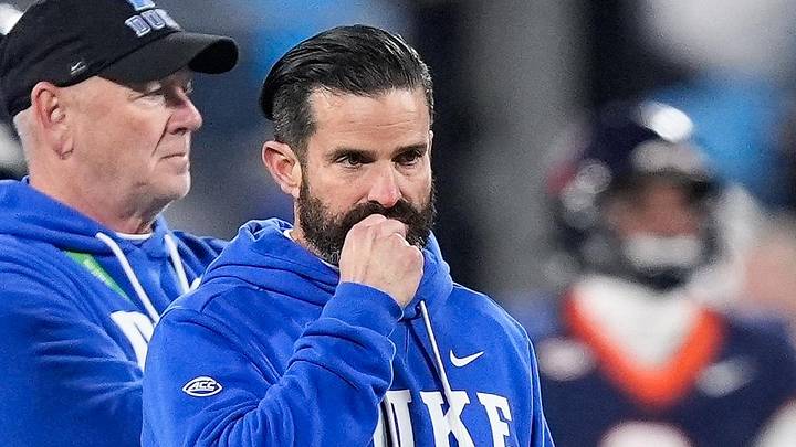 Dec 6, 2025; Charlotte, NC, USA; Duke Blue Devils head coach Manny Diaz looks on during warm ups prior to the the 2025 ACC Championship game against the Virginia Cavaliers at Bank of America Stadium. Mandatory Credit: Jim Dedmon-Imagn Images Dec 6, 2025; Charlotte, NC, USA; Duke Blue Devils head coach Manny Diaz looks on during warm ups prior to the the 2025 ACC Championship game against the Virginia Cavaliers at Bank of America Stadium. Mandatory Credit: Jim Dedmon-Imagn Images