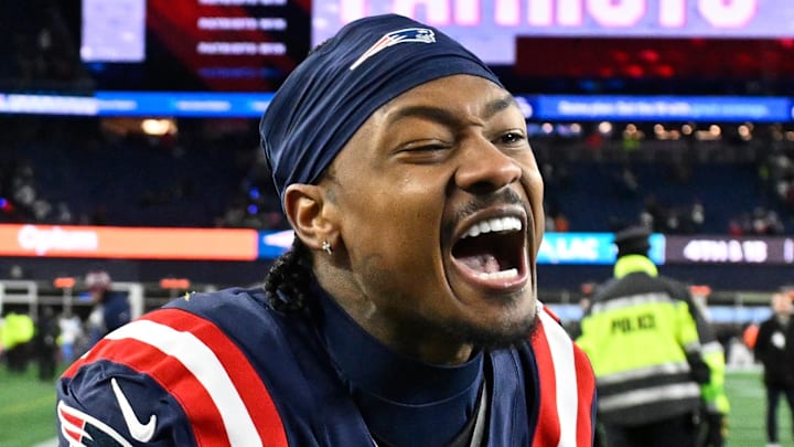 Jan 11, 2026; Foxborough, MA, USA; New England Patriots wide receiver Stefon Diggs (8) reacts after defeating the Los Angeles Chargers in an AFC Wild Card Round game at Gillette Stadium. Mandatory Credit: Eric Canha-Imagn Images