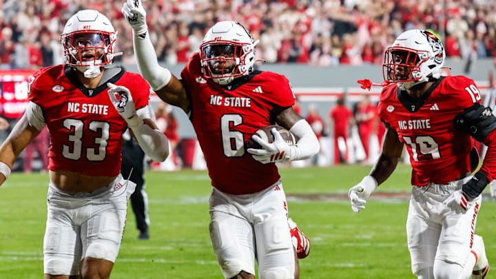 Nov 21, 2025; Raleigh, North Carolina, USA; NC State Wolfpack defensive back Devon Marshall (6) celebrates a down and runs towards the JROTC  to celebrate during the first half of the game against Florida State Seminoles at Carter-Finley Stadium. Mandatory Credit: Jaylynn Nash-Imagn Images
