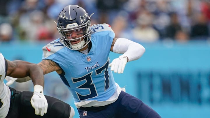Jacksonville Jaguars running back Tank Bigsby (4) is stopped by Tennessee Titans safety Amani Hooker (37) during the third quarter at Nissan Stadium in Nashville, Tenn., Sunday, Dec. 8, 2024.