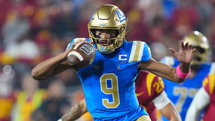 Nov 29, 2025; Los Angeles, California, USA; UCLA Bruins quarterback Nico Iamaleava (9) carries the ball against the Southern California Trojans in the first half at United Airlines Field at Los Angeles Memorial Coliseum. Mandatory Credit: Kirby Lee-Imagn Images