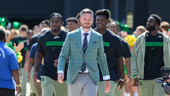 Aug 31, 2024; Eugene, Oregon, USA; Oregon Ducks head coach Dan Lanning leads the team into the stadium before the game against the Idaho Vandals at Autzen Stadium. Mandatory Credit: Craig Strobeck-Imagn Images