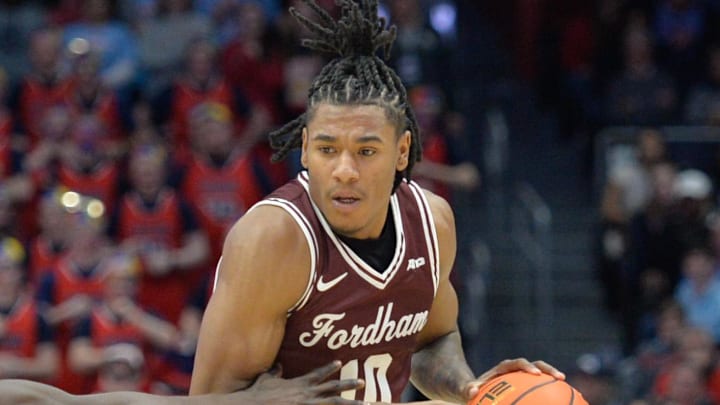 Feb 17, 2024; Dayton, Ohio, USA;  Fordham guard Kyle Rose (10) battles against Dayton Flyers guard Enoch Cheeks (6) during the game at University of Dayton Arena. Mandatory Credit: Matt Lunsford-Imagn Images