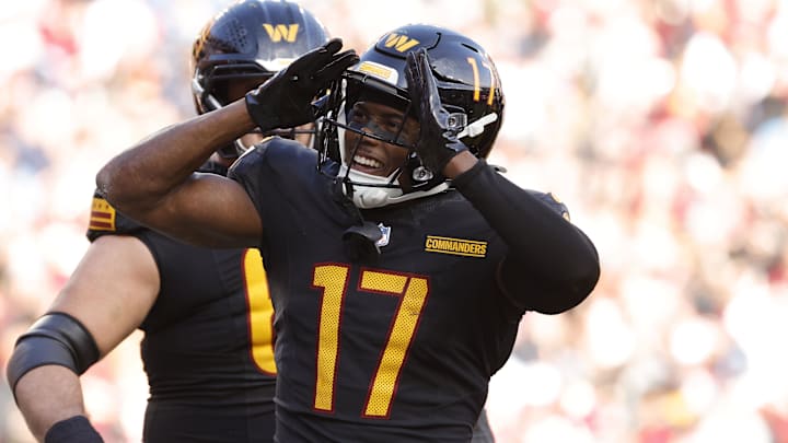 Dec 1, 2024; Landover, Maryland, USA; Washington Commanders wide receiver Terry McLaurin (17) celebrates with fans in the stands after scoring a touchdown against Tennessee Titans during the first half at Northwest Stadium. Mandatory Credit: Amber Searls-Imagn Images Dec 1, 2024; Landover, Maryland, USA; Washington Commanders wide receiver Terry McLaurin (17) celebrates with fans in the stands after scoring a touchdown against Tennessee Titans during the first half at Northwest Stadium. Mandatory Credit: Amber Searls-Imagn Images