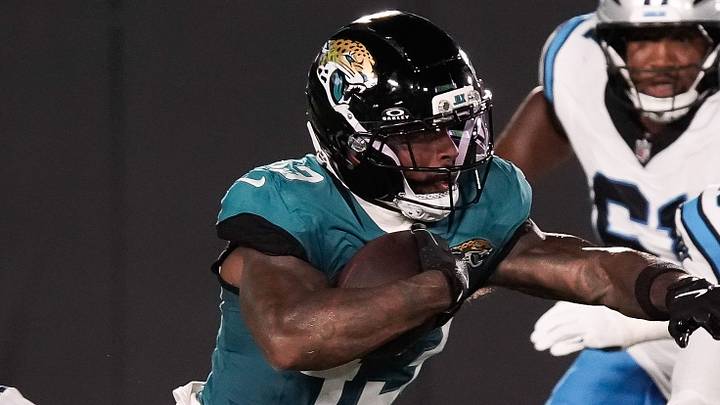 Jacksonville Jaguars running back Ameer Abdullah (43) eludes Carolina Panthers cornerback Chau Smith-Wade (26) in the first quarter during the first half against the Carolina Panthers at EverBank Stadium in the second preseason game on Friday night, August 21, 2026 in Jacksonville, Fla. [Doug Engle/Florida Times-Union]