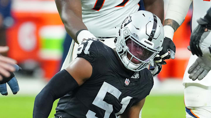 Jan 7, 2024; Paradise, Nevada, USA; Denver Broncos quarterback Jarrett Stidham (4) reacts after being knocked down by Las Vegas Raiders defensive end Malcolm Koonce (51) during the second quarter at Allegiant Stadium. Mandatory Credit: Stephen R. Sylvanie-Imagn Images