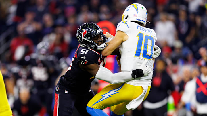 Will Anderson Jr. hits Las Angeles Chargers quarterback Justin Herbert in a Houston Texans Wild Card Round win