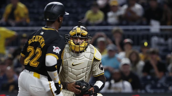 San Diego Padres catcher Luis Campusano (12) tags Pittsburgh Pirates designated hitter Andrew McCutchen (22) out at home plate during the tenth inning at PNC Park. San Diego won 9-8 in ten innings on Aug. 7, 2024.