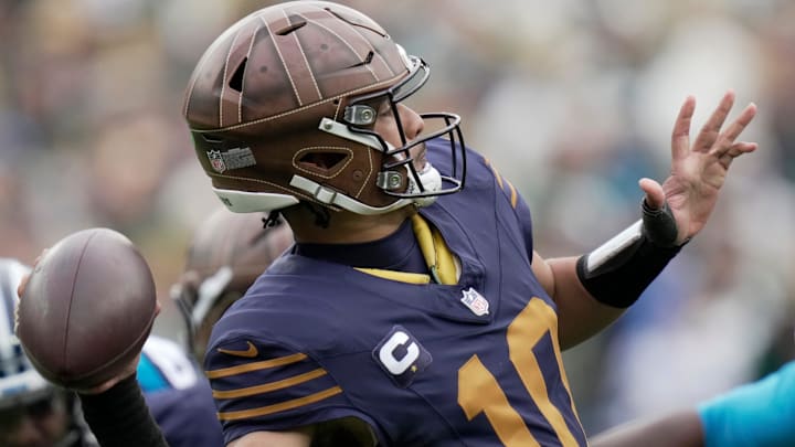 Green Bay Packers quarterback Jordan Love (10) throws downfield during the second quarter of their game against Carolina.