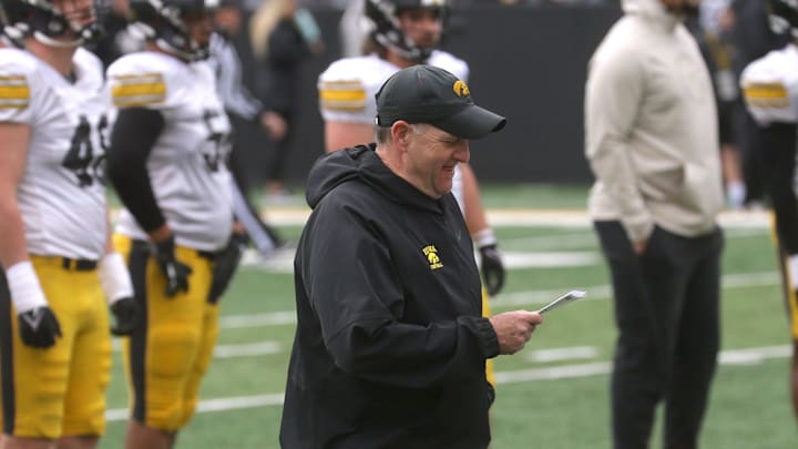 Iowa Hawkeyes defensive coordinator Phil Parker consults his play sheet during an open spring practice Saturday, April 20, 2024 at Kinnick Stadium in Iowa City, Iowa.