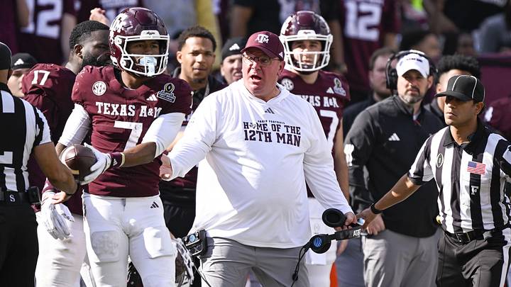 Texas A&M Aggies head coach Mike Elko reacts to a call during the game between the Aggies and the Hurricanes at Kyle Field. Texas A&M Aggies head coach Mike Elko reacts to a call during the game between the Aggies and the Hurricanes at Kyle Field.