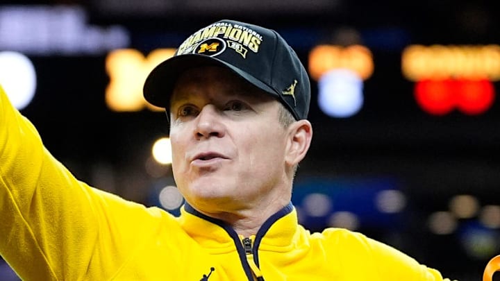 Michigan head coach Dusty May swings the net after winning the NCAA national championship against Connecticut at Lucas Oil Stadium in Indianapolis on Monday, April 6, 2026. Michigan head coach Dusty May swings the net after winning the NCAA national championship against Connecticut at Lucas Oil Stadium in Indianapolis on Monday, April 6, 2026.