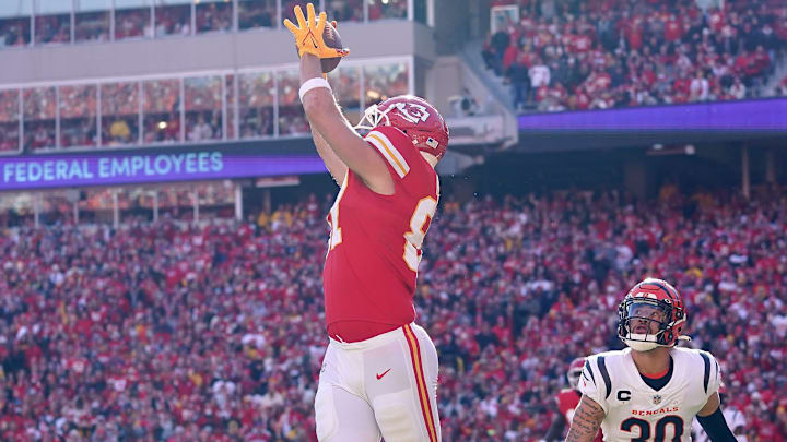 Kansas City Chiefs tight end Travis Kelce (87) catches a touchdown as Cincinnati Bengals free safety Jessie Bates (30) defends in the second quarter during the AFC championship NFL football game on Jan. 30, 2022, at GEHA Field at Arrowhead Stadium in Kansas City.