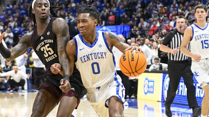 Mar 15, 2024; Nashville, TN, USA;  Kentucky Wildcats guard Rob Dillingham (0) drives past Texas A&M Aggies guard Manny Obaseki (35) during the second half at Bridgestone Arena. Mandatory Credit: Steve Roberts-USA TODAY Sports