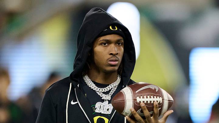 Nov 14, 2025; Eugene, Oregon, USA; Oregon Ducks wide receiver Dakorien Moore (1) watches teammates warm up before a game against the Minnesota Golden Gophers at Autzen Stadium. Mandatory Credit: Troy Wayrynen-Imagn Images Nov 14, 2025; Eugene, Oregon, USA; Oregon Ducks wide receiver Dakorien Moore (1) watches teammates warm up before a game against the Minnesota Golden Gophers at Autzen Stadium. Mandatory Credit: Troy Wayrynen-Imagn Images