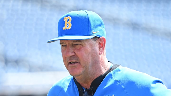 Jun 14, 2025; Omaha, Neb, USA;  UCLA Bruins head coach John Savage on the field before the game against the Murray State Races at Charles Schwab Field. Mandatory Credit: Steven Branscombe-Imagn Images
