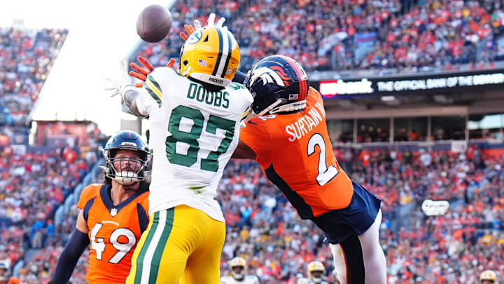 Oct 22, 2023; Denver, Colorado, USA; Green Bay Packers wide receiver Romeo Doubs (87) pulls in a touchdown past Denver Broncos cornerback Pat Surtain II (2) and linebacker Alex Singleton (49) in the fourth quarter at Empower Field at Mile High. Oct 22, 2023; Denver, Colorado, USA; Green Bay Packers wide receiver Romeo Doubs (87) pulls in a touchdown past Denver Broncos cornerback Pat Surtain II (2) and linebacker Alex Singleton (49) in the fourth quarter at Empower Field at Mile High.