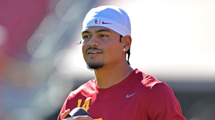 Oct 11, 2025; Los Angeles, California, USA;  USC Trojans quarterback Jayden Maiava (14) warms up prior to the game against the Michigan Wolverines at United Airlines Field at the Los Angeles Memorial Coliseum. Mandatory Credit: Jayne Kamin-Oncea-Imagn Images