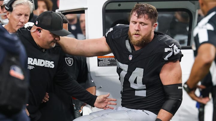 Sep 28, 2025; Paradise, Nevada, USA; Las Vegas Raiders offensive tackle Kolton Miller (74) is loaded onto the medical cart during the second half against the Chicago Bears at Allegiant Stadium. Mandatory Credit: Kiyoshi Mio-Imagn Images