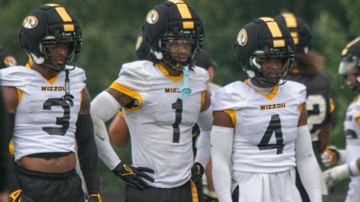 Aug 6, 2025; Columbia, MO, USA; Missouri Tigers safeties Mose Phillips III (3), Marvin Burks Jr. (1) and Caleb Flagg (4) prepare for a defensive drill at a fall camp practice at Mizzou Athletic Training Complex. Aug 6, 2025; Columbia, MO, USA; Missouri Tigers safeties Mose Phillips III (3), Marvin Burks Jr. (1) and Caleb Flagg (4) prepare for a defensive drill at a fall camp practice at Mizzou Athletic Training Complex.