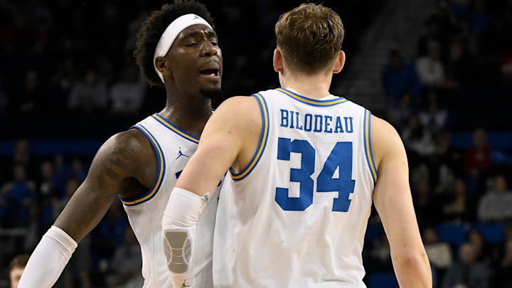 Mar 3, 2026; Los Angeles, California, USA; UCLA Bruins forward Tyler Bilodeau (34) chest dumps teammate Eric Dailey Jr. (3) after hitting a 3-point shot during the second} half at Pauley Pavilion presented by Wescom Financial. Mandatory Credit: Robert Hanashiro-Imagn Images