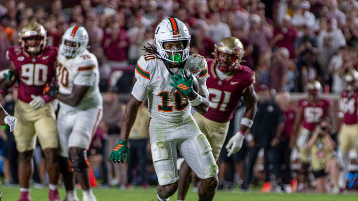 University of Miami wide receiver Malachi Toney (10) runs after catching a pass from quarterback Carson Beck (11).