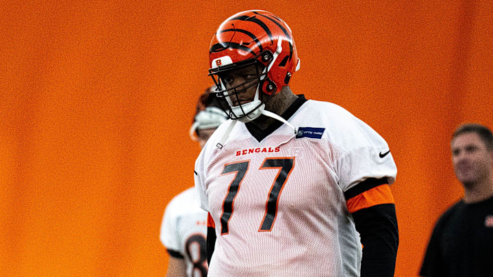 Cincinnati Bengals offensive tackle Trent Brown (77) walks to the line for field goal practice at Bengals spring practice at the IEL Indoor Facility in Cincinnati on Wednesday, June 12, 2024.