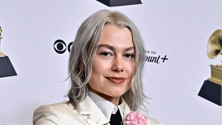 Phoebe Bridgers takes a photo at the Grammy Awards