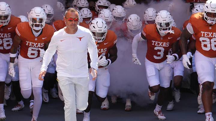 Texas Longhorns Head Coach Steve Sarkisian leads his team on to the field before a game against the Texas State Bobcats at Darrell K Royal-Texas Memorial Stadium. Texas Longhorns Head Coach Steve Sarkisian leads his team on to the field before a game against the Texas State Bobcats at Darrell K Royal-Texas Memorial Stadium.